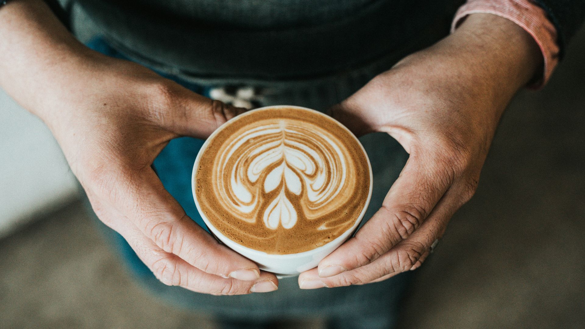 focus photography of coffee artwork