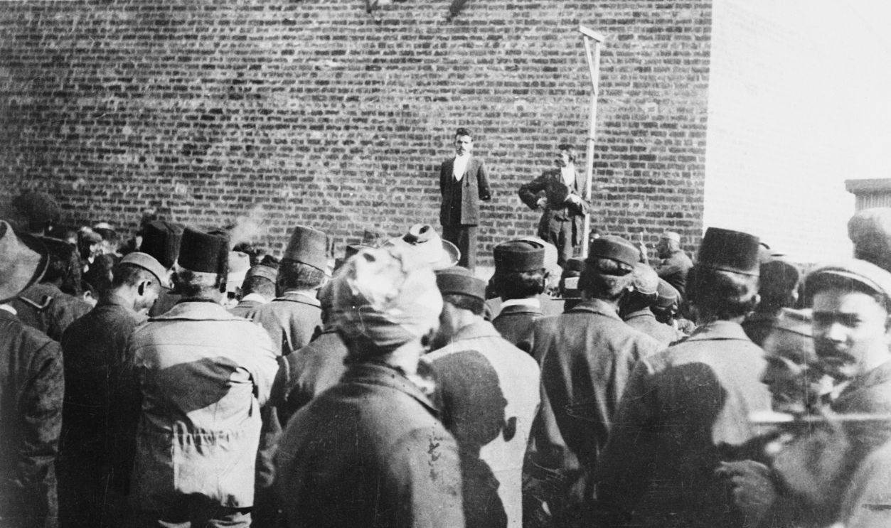 Mahatma Gandhi, India's late famed Hindu leader, is shown addressing an outdoor meeting of his countrymen in May, 1919, in Calcutta. At this early stage in his career, Gandhi wore the conventional civilian clothes which he later discarded in favor of the hand-spun loincloth which became the symbol of his crusade for Indian independence.