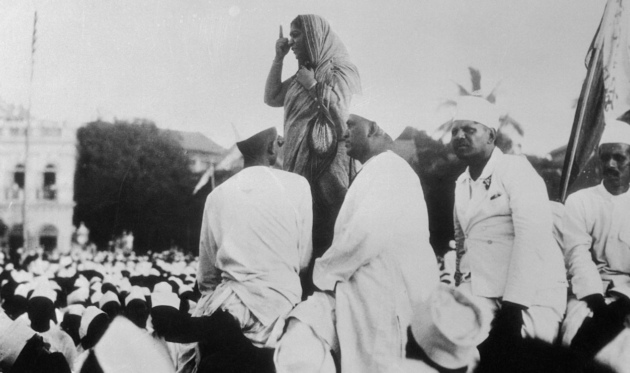 Mrs. sarajini Naida, aide to Mahatma Ghandhi carried on his work and was photographed shortly before she was arrested for landing a demonstration of disobedience by gathering salt.
