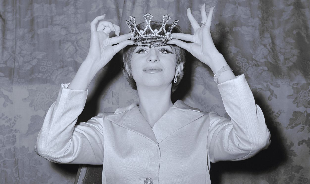 Gettyimages - 515492476, Ziegfeld Crown for Funny Girl Musical comedy star, Barbra Streisand, eyes the crown she received as 