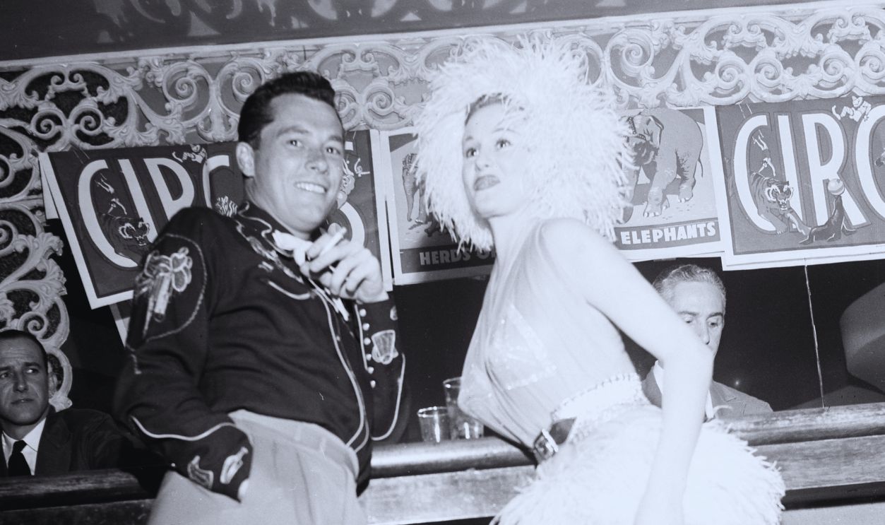 Gettyimages - 451348145, Conrad Hilton, Jr... LOS ANGELES - FEBRUARY 5, 1955 : Conrad Hilton, Jr with guest attends Sonja Henie Circus party in Los Angeles, California. 