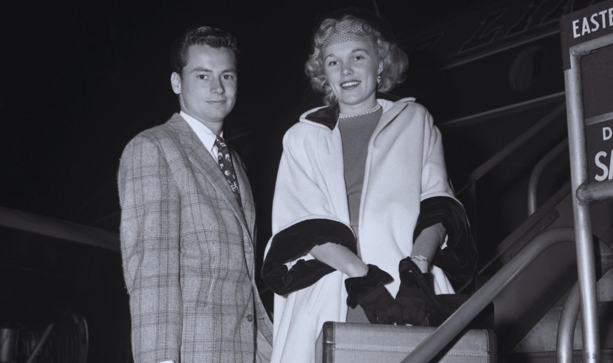Gettyimages - 515335880, Barron Hilton and Wife Marilyn Hilton Barron Hilton and wife Marilyn Hilton. They are shown on steps of plane on their way to Houston, Texas.