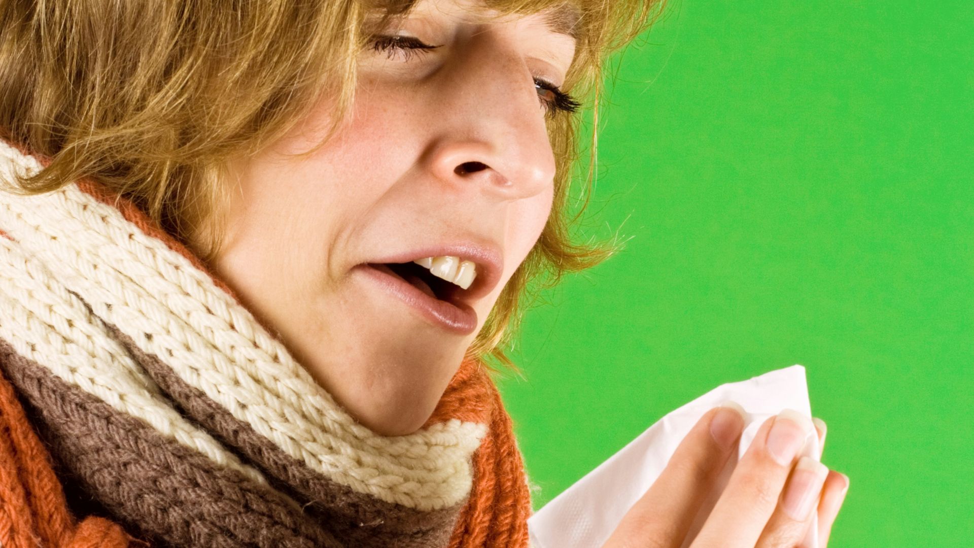 A woman wearing a scarf and a scarf around her neck