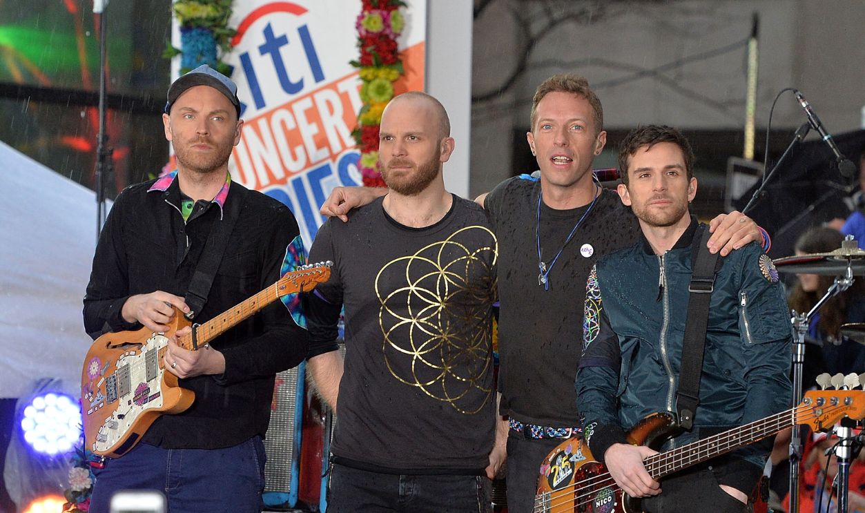  (L-R) guitarist Jonny Buckland, drummer Will Champion, singer Chris Martin and bassist Guy Berryman of Coldplay perform on NBC's 