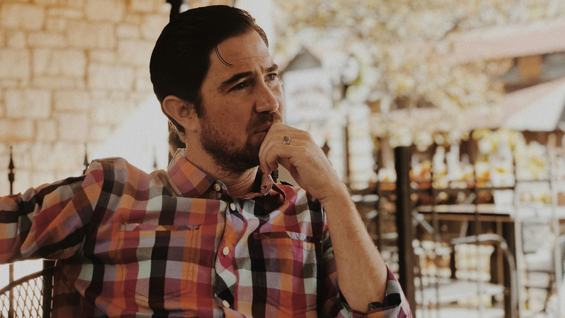 man in red and black plaid dress shirt