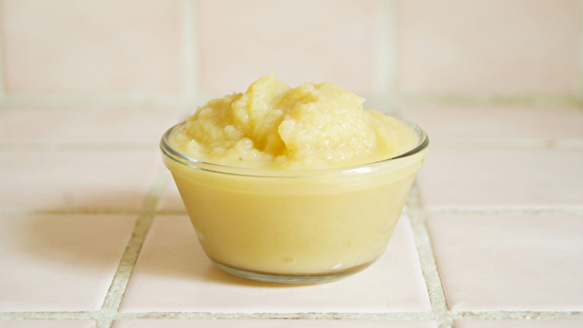 yellow cream in clear glass bowl