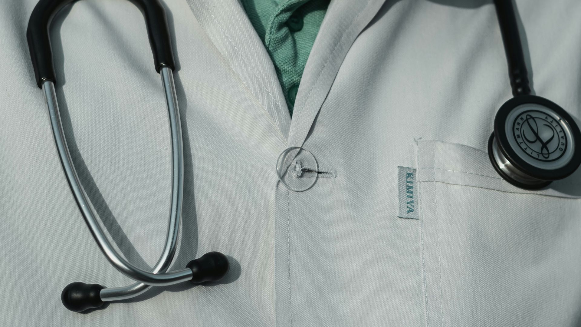 person in white and black stethoscope