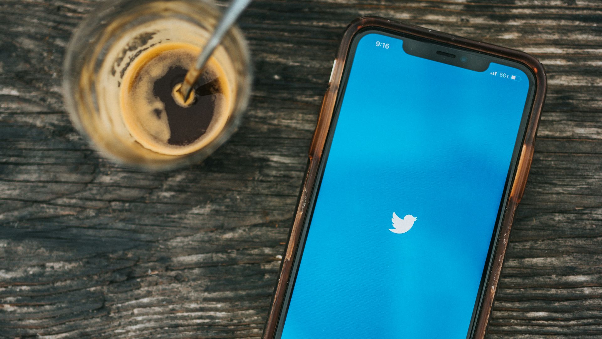 blue ipod touch on brown wooden table