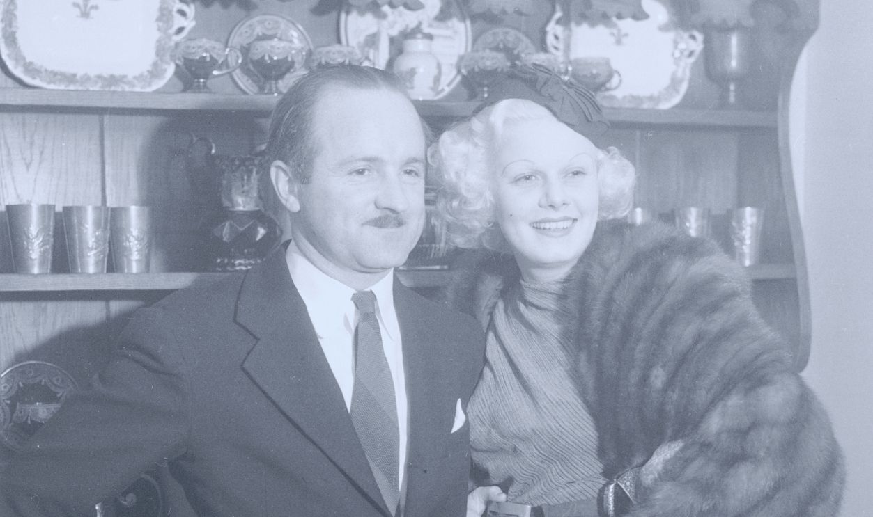 Gettyimages - 517286368, Jean Harlow Posing with Husband Harold Rosson (Original Caption) Screen Folk at Christmas Party. Jean Harlow, platinum blonde film beauty, and her husband, Harold Rosson, shown as they attended the Christmas Day party given by Colleen Moore at her Bel Air, Calif., estate.