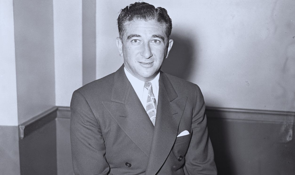 Gettyimages - 515428912, Abner Zwillman Sitting on Edge of Desk with Cigar in Hand (Original Caption) Abner