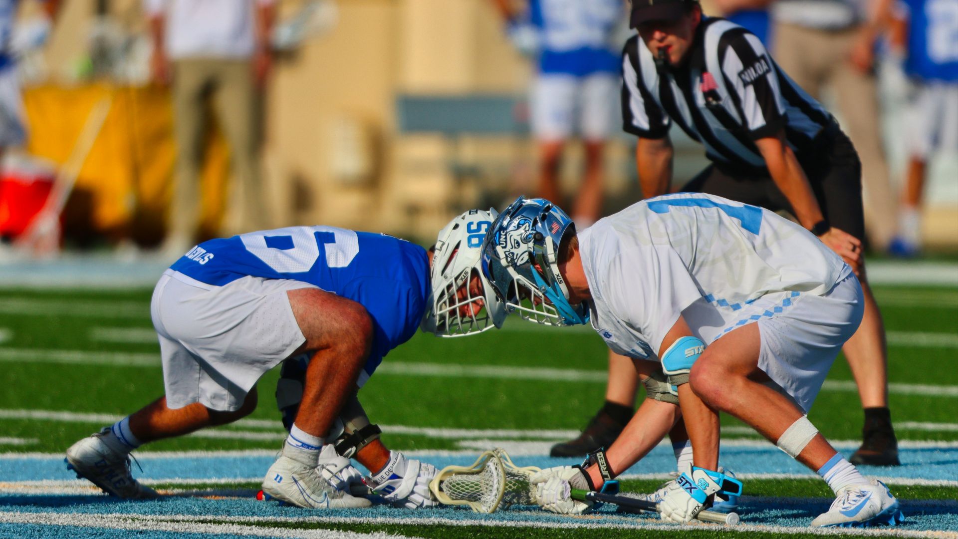 football players on field during daytime