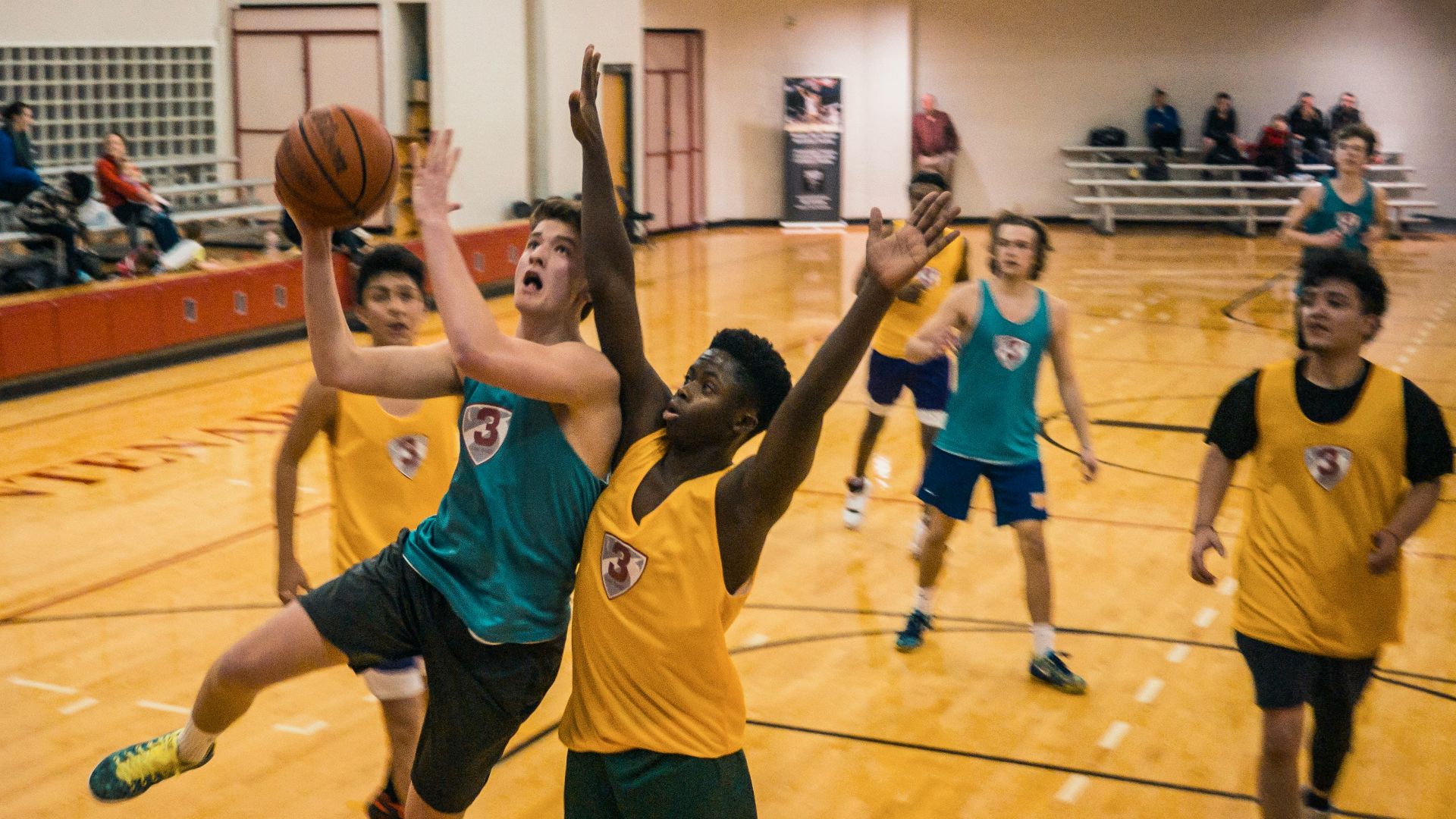 group of people playing basketball
