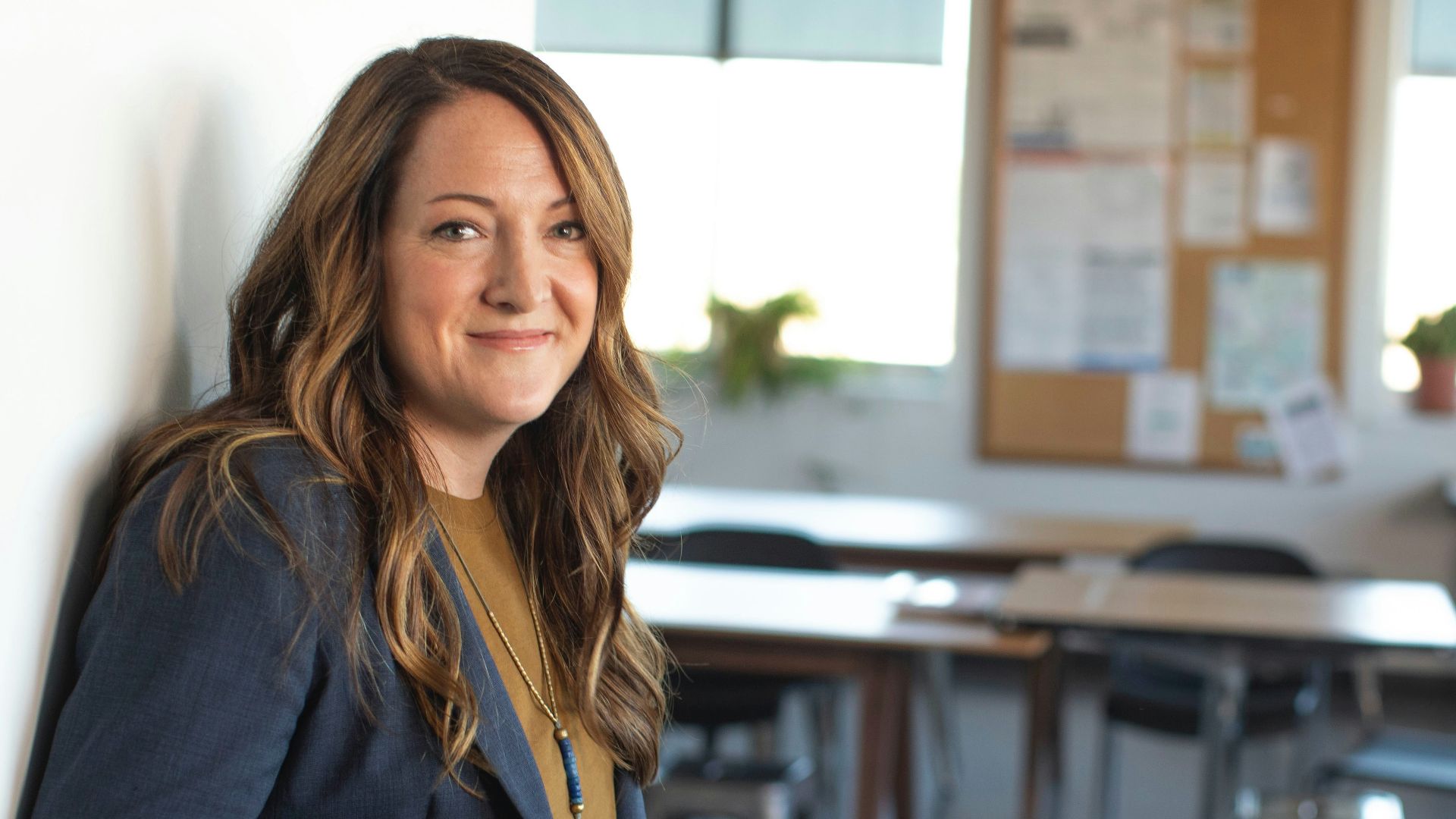 woman in black coat sitting on chair