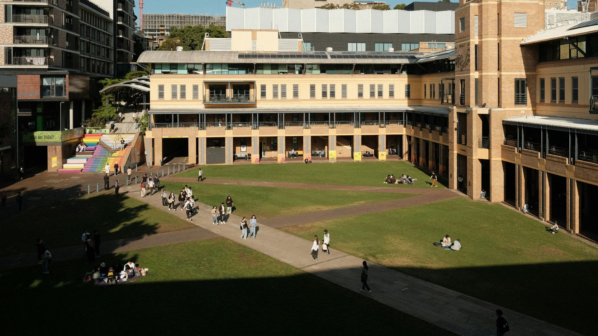 A large building with a clock tower in the middle of it