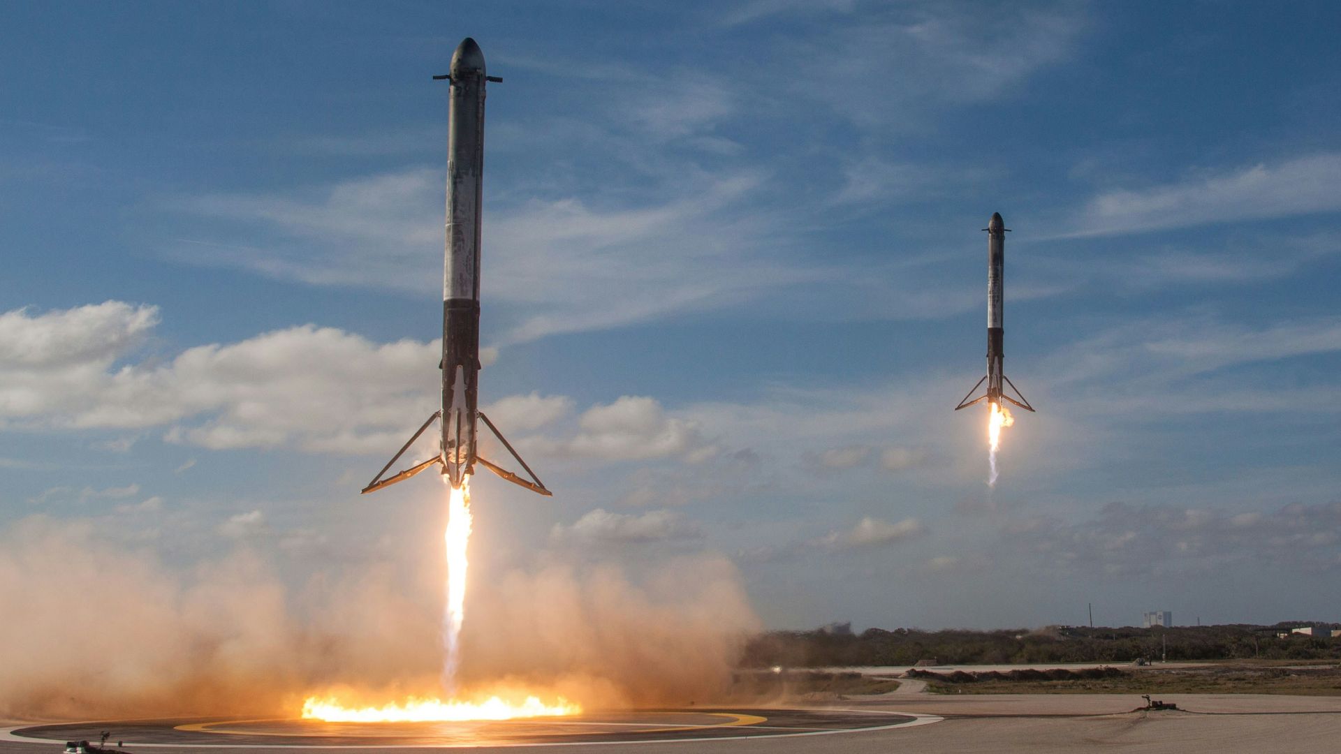 twom white flying rockets during daytime