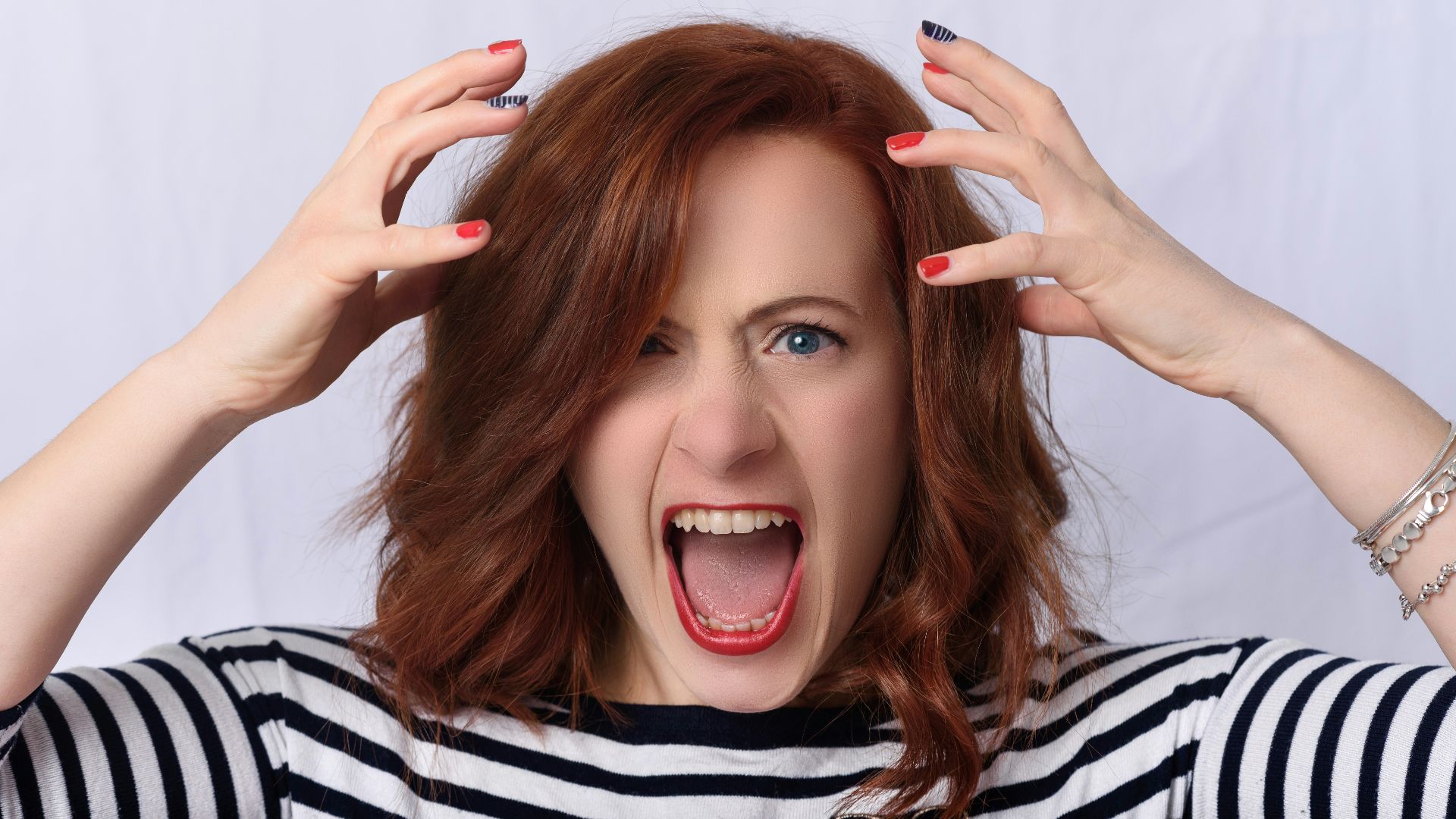 smiling girl in black and white striped shirt