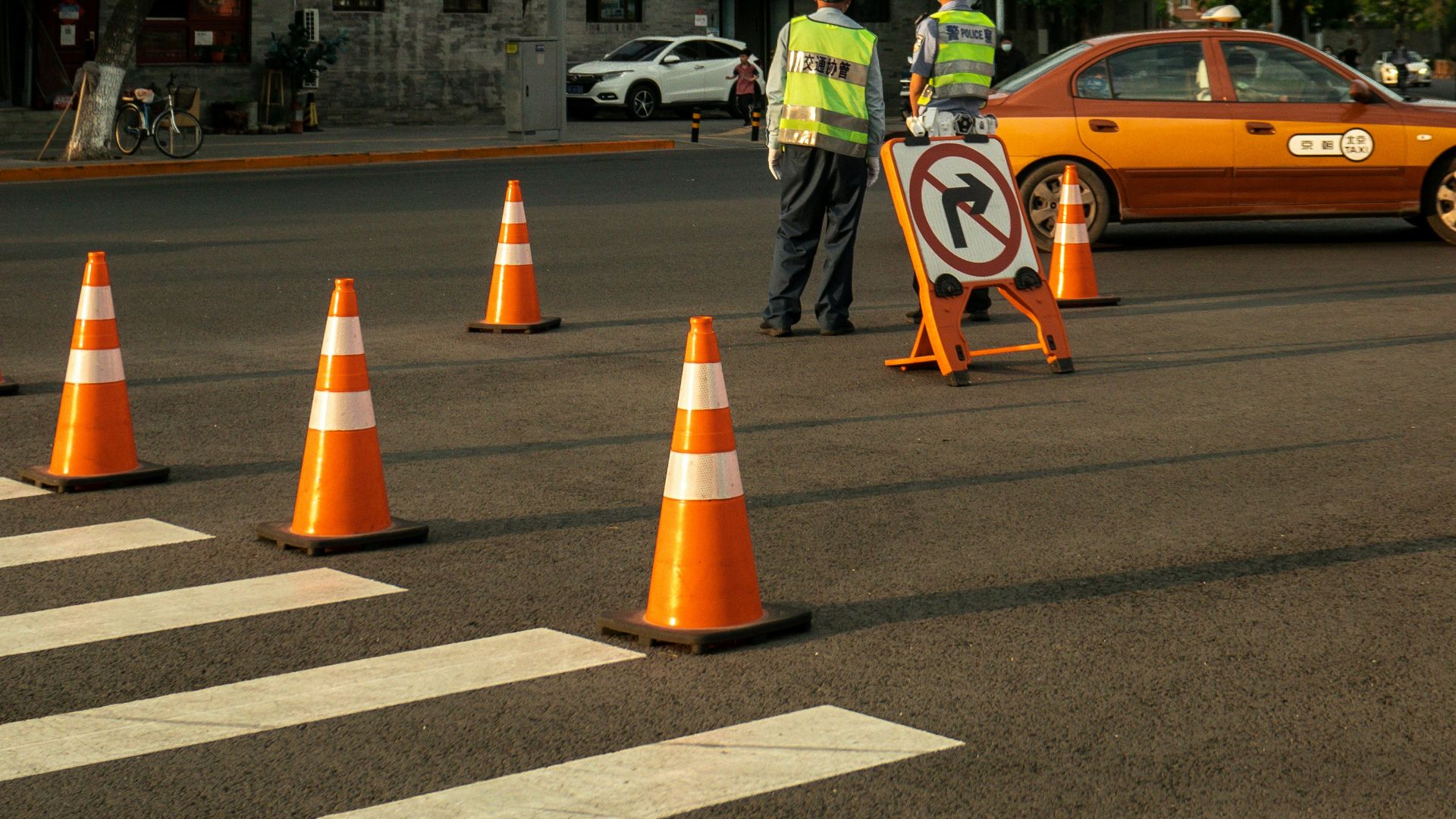 a group of workers stand in the middle of a street