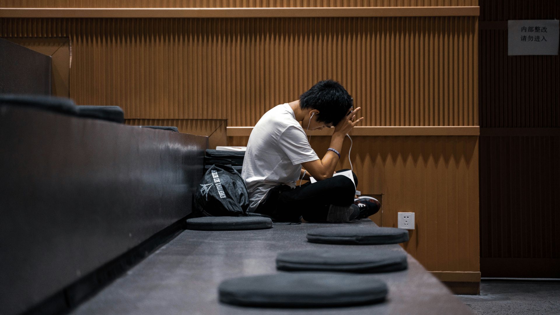 man in white dress shirt sitting on chair