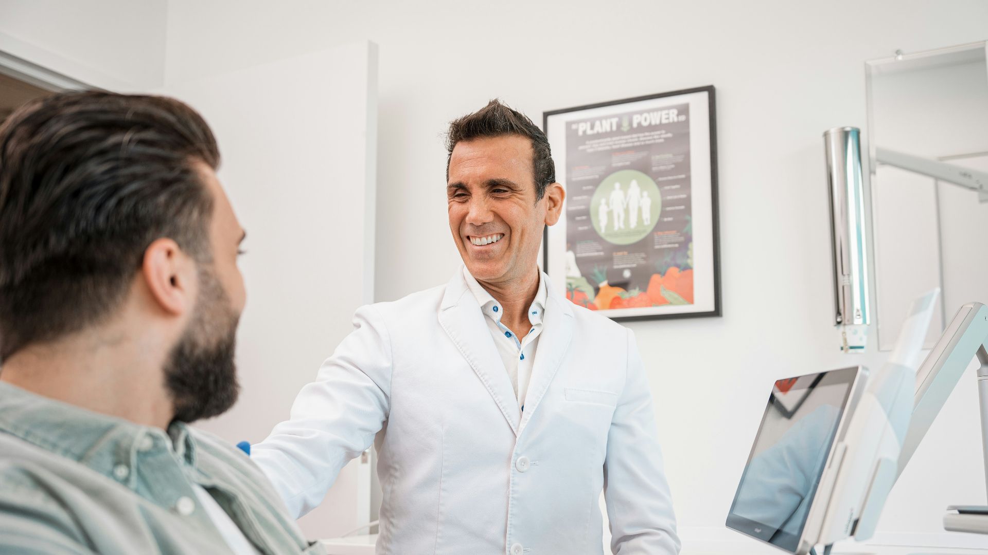 a man smiling at another man