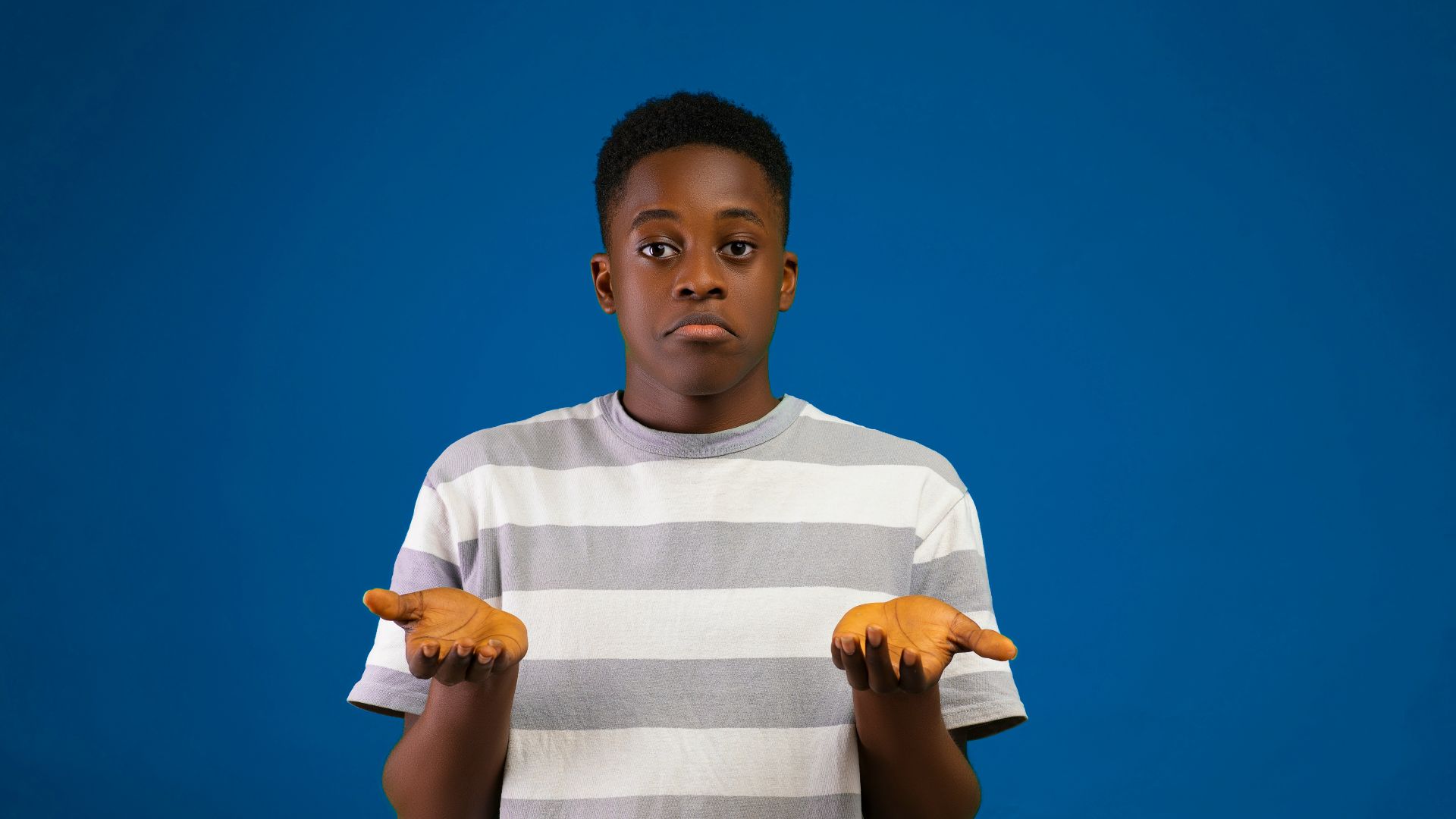 a boy with his arms crossed