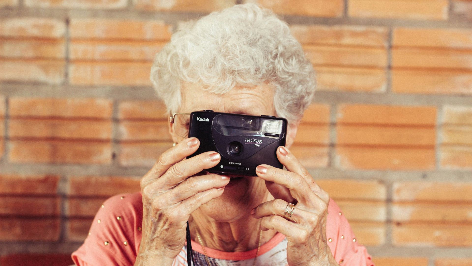 woman holding film camera