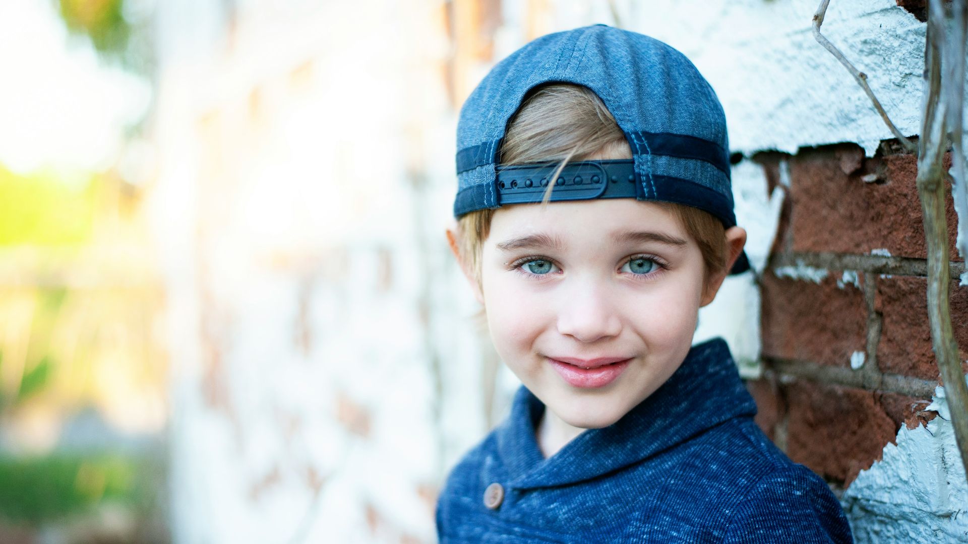 girl in blue knit cap and blue sweater