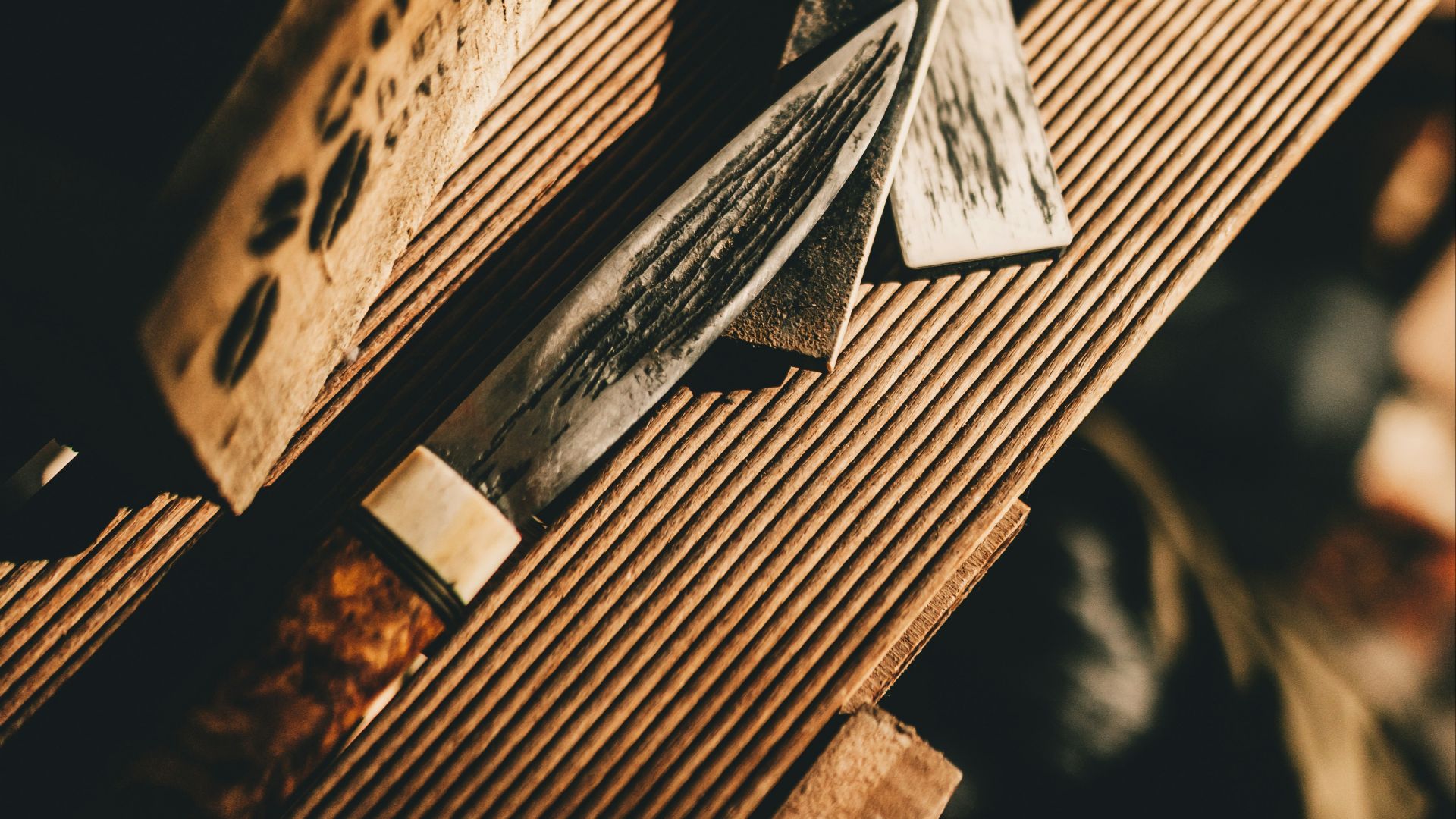 a pair of scissors sitting on top of a wooden table