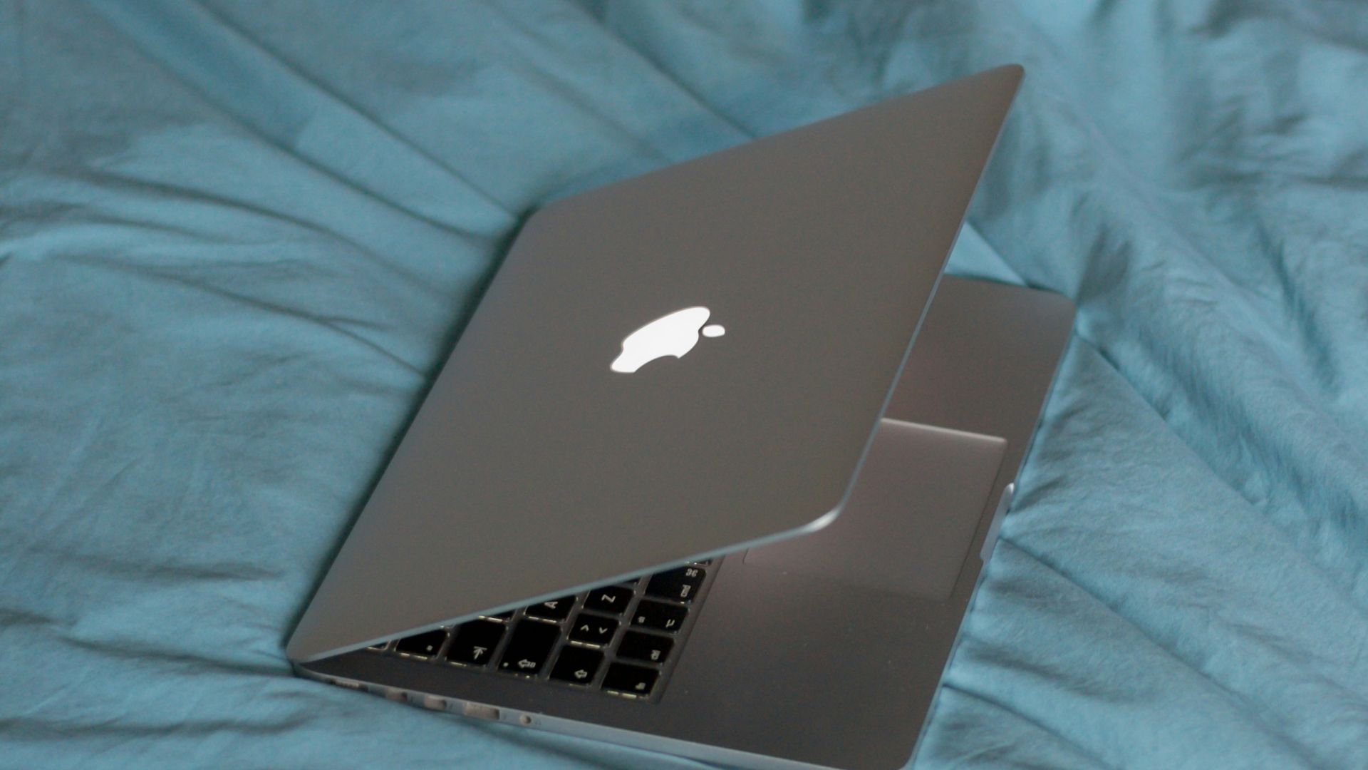 macbook air on pink textile