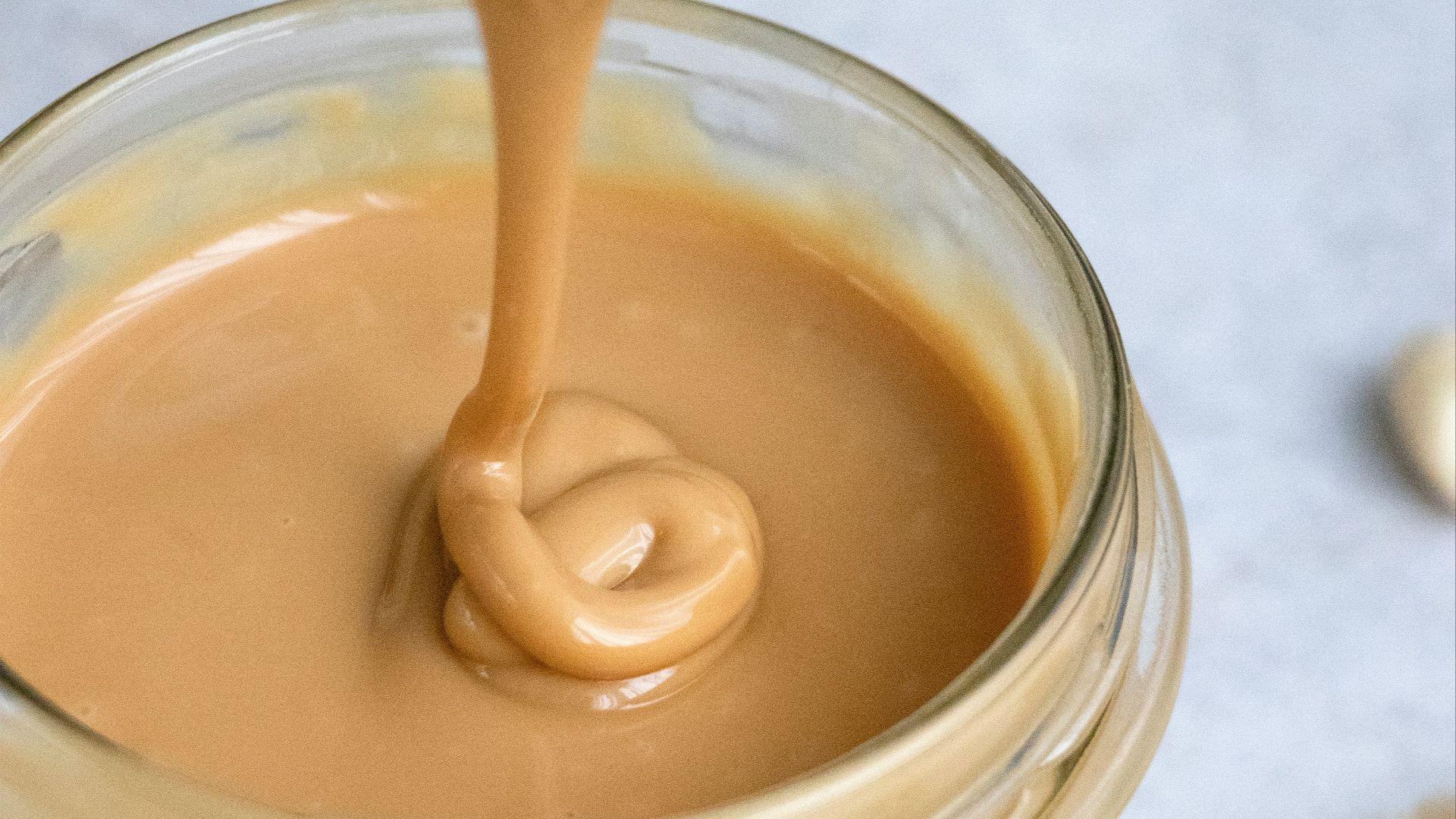clear glass jar with brown liquid