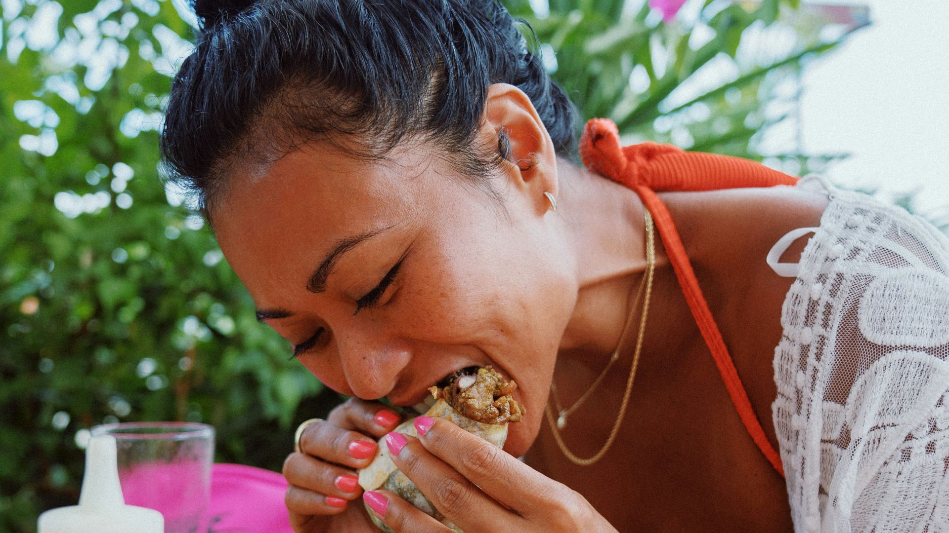 woman in white lace shirt holding brown woven basket