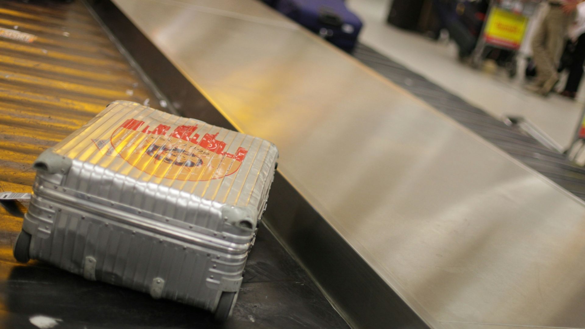 gray hardside luggage