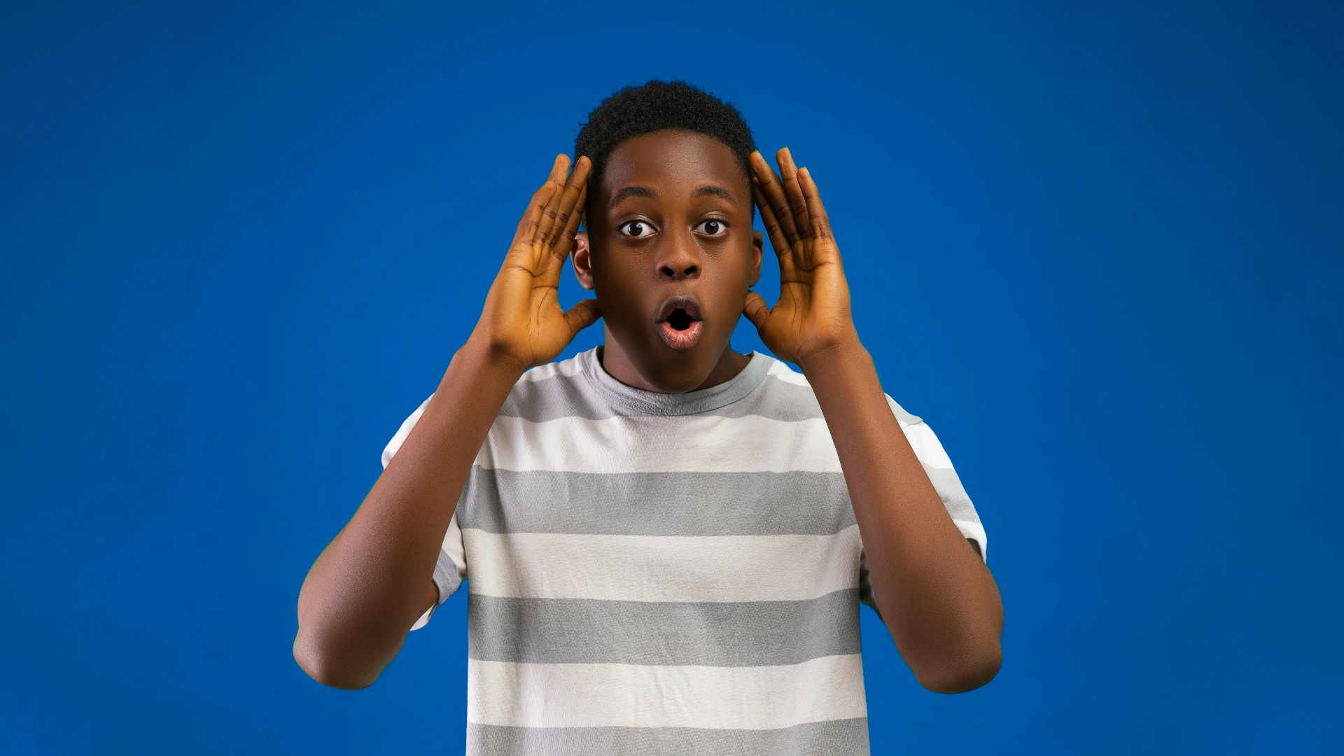 a woman with her hands on her face