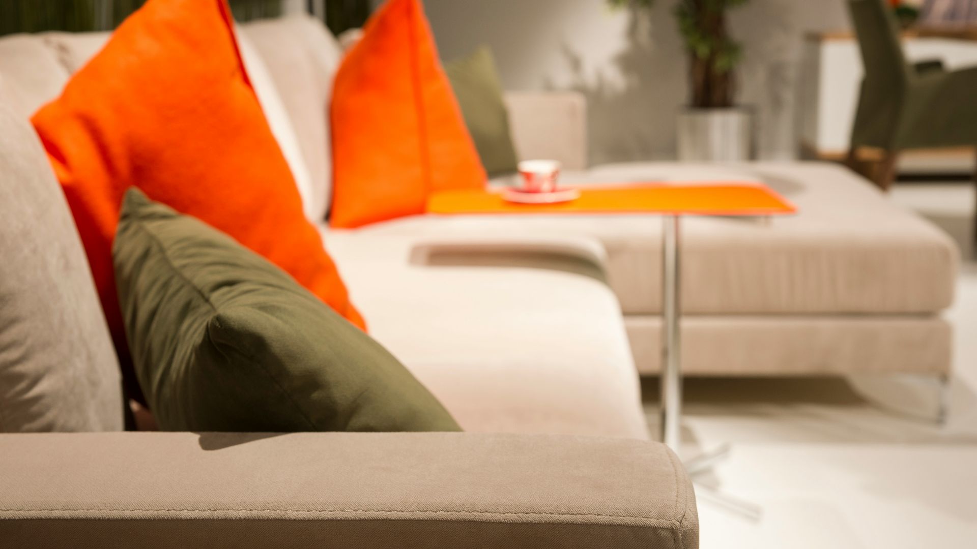 orange throw pillow on white couch