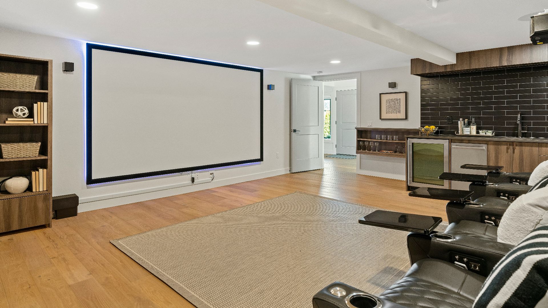 a living room with a large projection screen