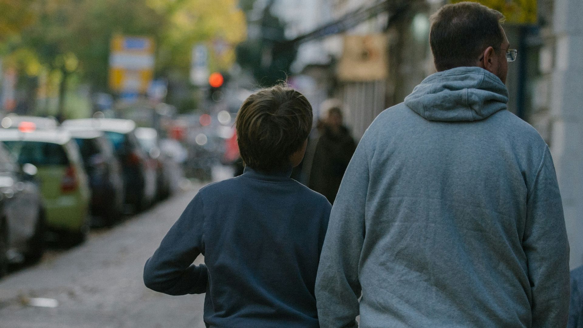 a group of people walking down a street