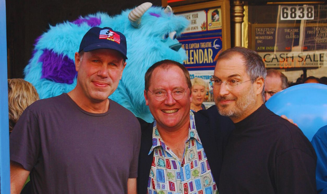 Gettyimages - 529842406, Michael Eisner, John Lasseter, and Steve Jobs Walt Disney Company CEO Michael Eisner, Pixar producer John Lasseter, and Pixar Studios President Steve Jobs attend the opening of the 2001 Disney-Pixar co-release Monsters, Inc..
