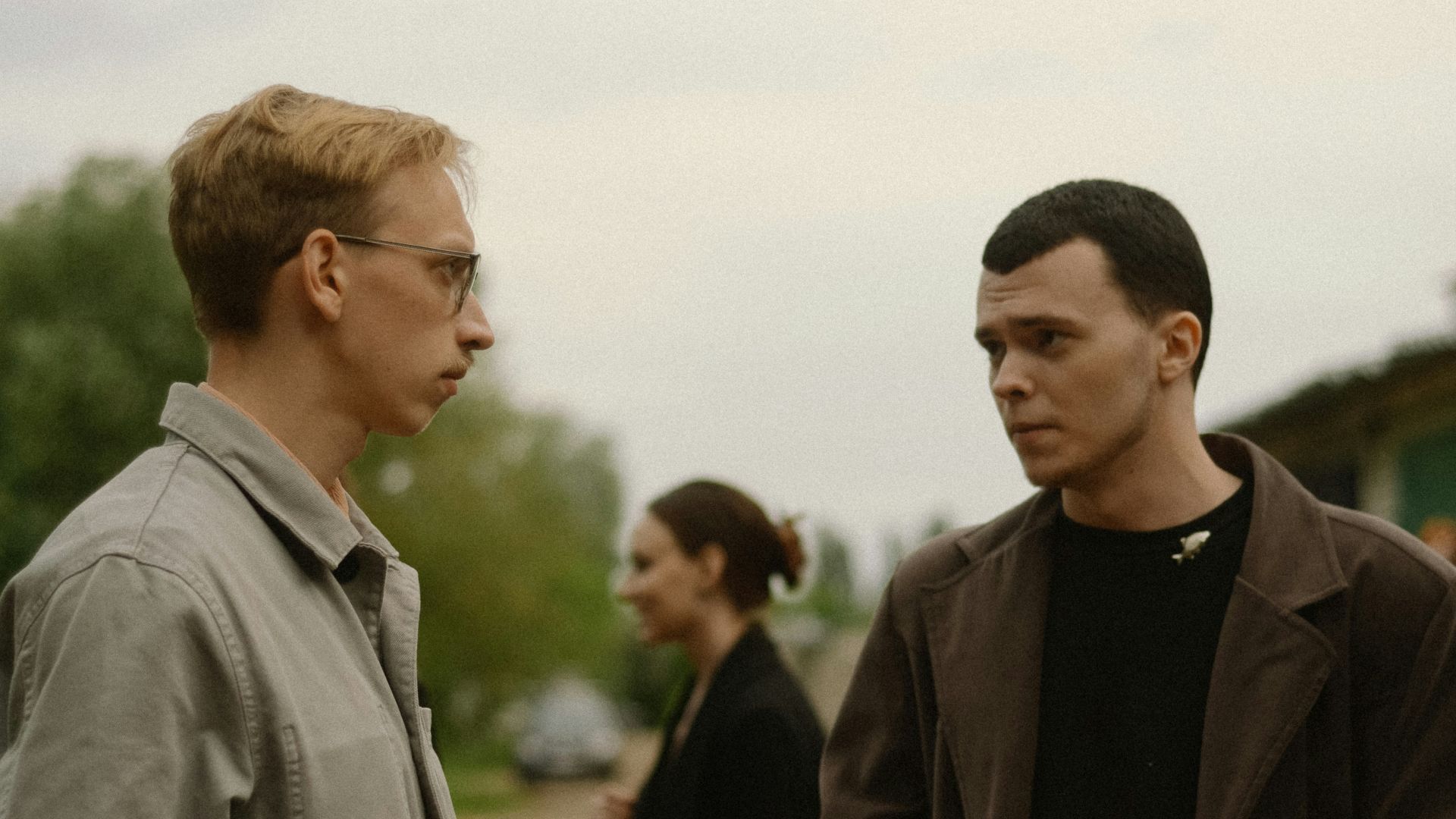 a couple of men standing next to each other