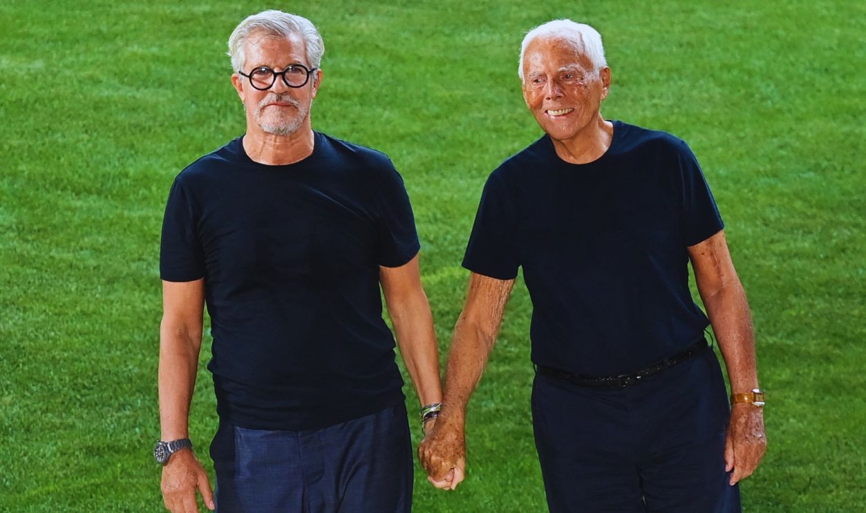 Gettyimages - 1233580163, FASHION-ITALY-MEN-ARMANI Italian fashion designer Giorgio Armani (R) and his historical collaborator Leo Dell'Orco acknowledge applause following the presentation of Giorgio Armani's Men's Spring Summer 2022 fashion collection on June 21, 2021 during the Milan Fashion Week. 