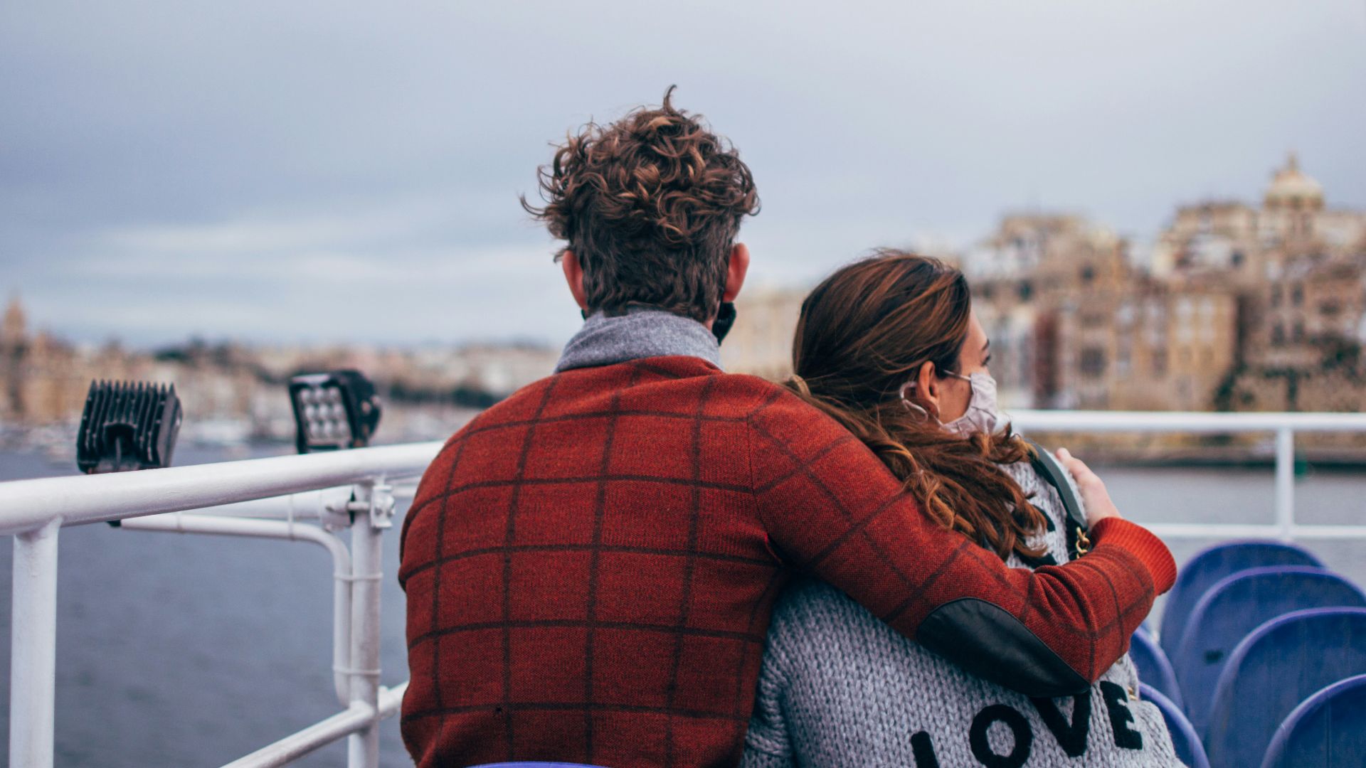 couple standing on white ship during daytime