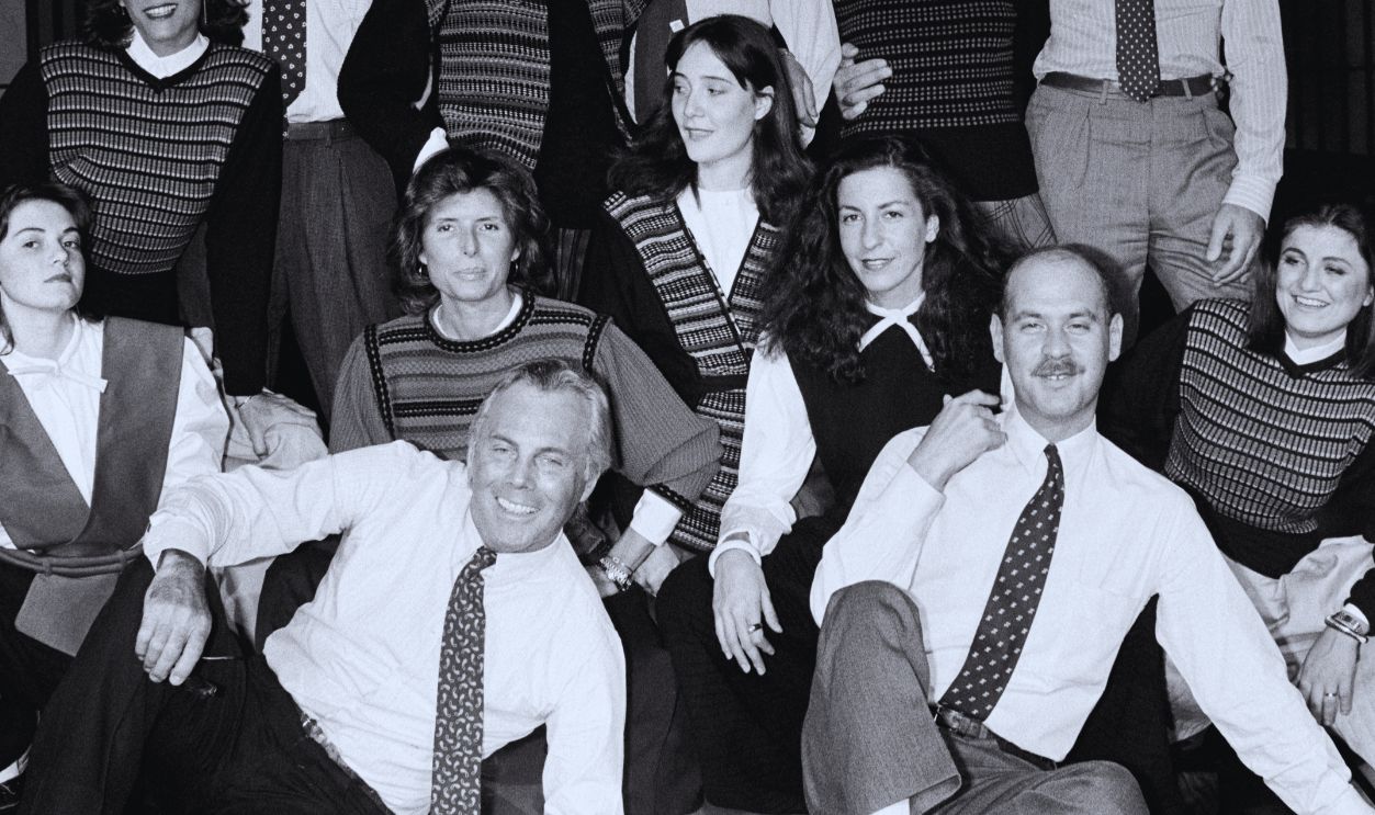 Gettyimages - 1429711946, Portraits of Giorgio Armani and Staff Designer Giorgio Armani, Silvana Armani, Sergio Galeotti, and guests pose for group photo. Some of the staff members wear selections from Armani's ready to wear collection. 