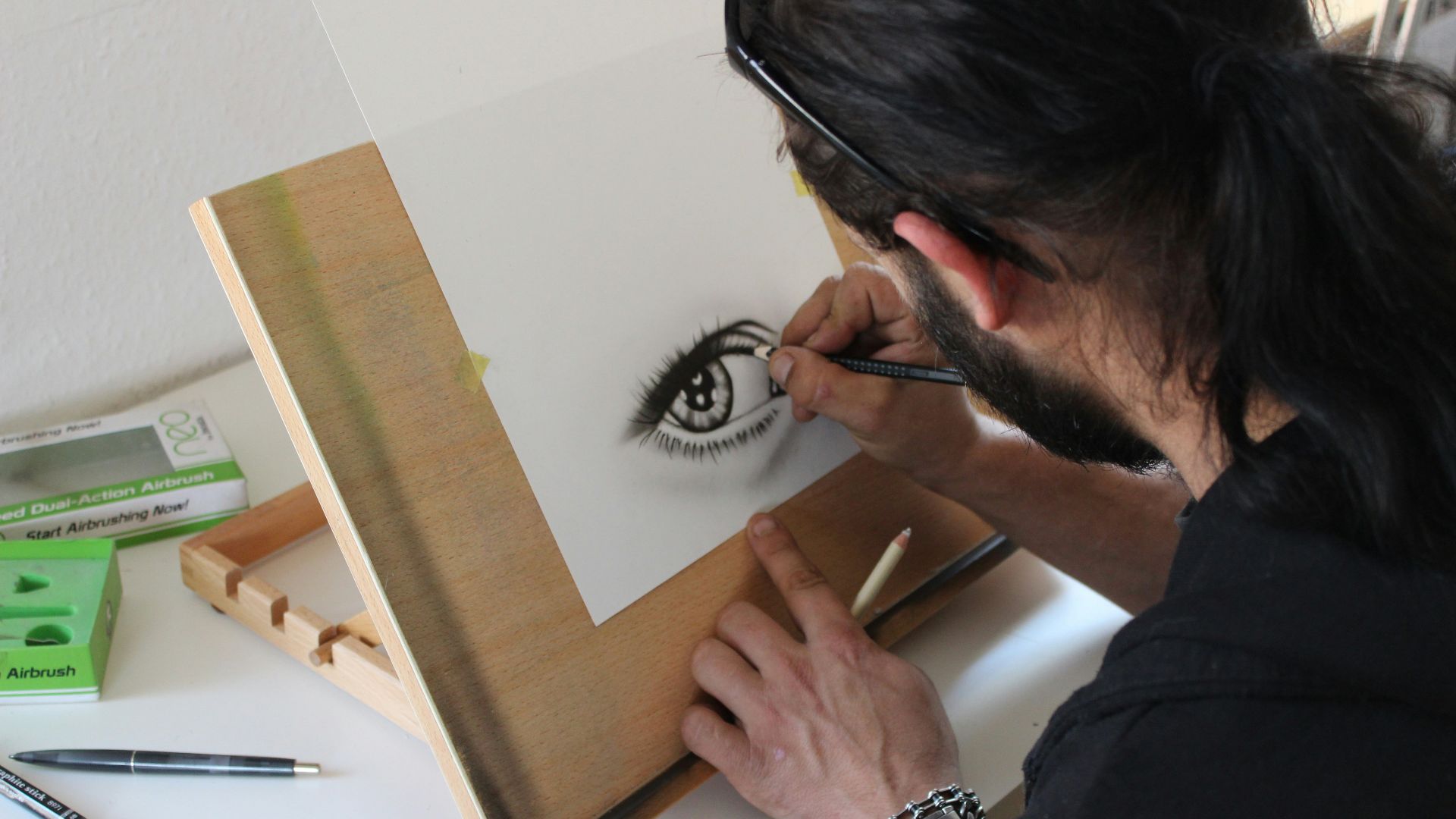 man painting human eye