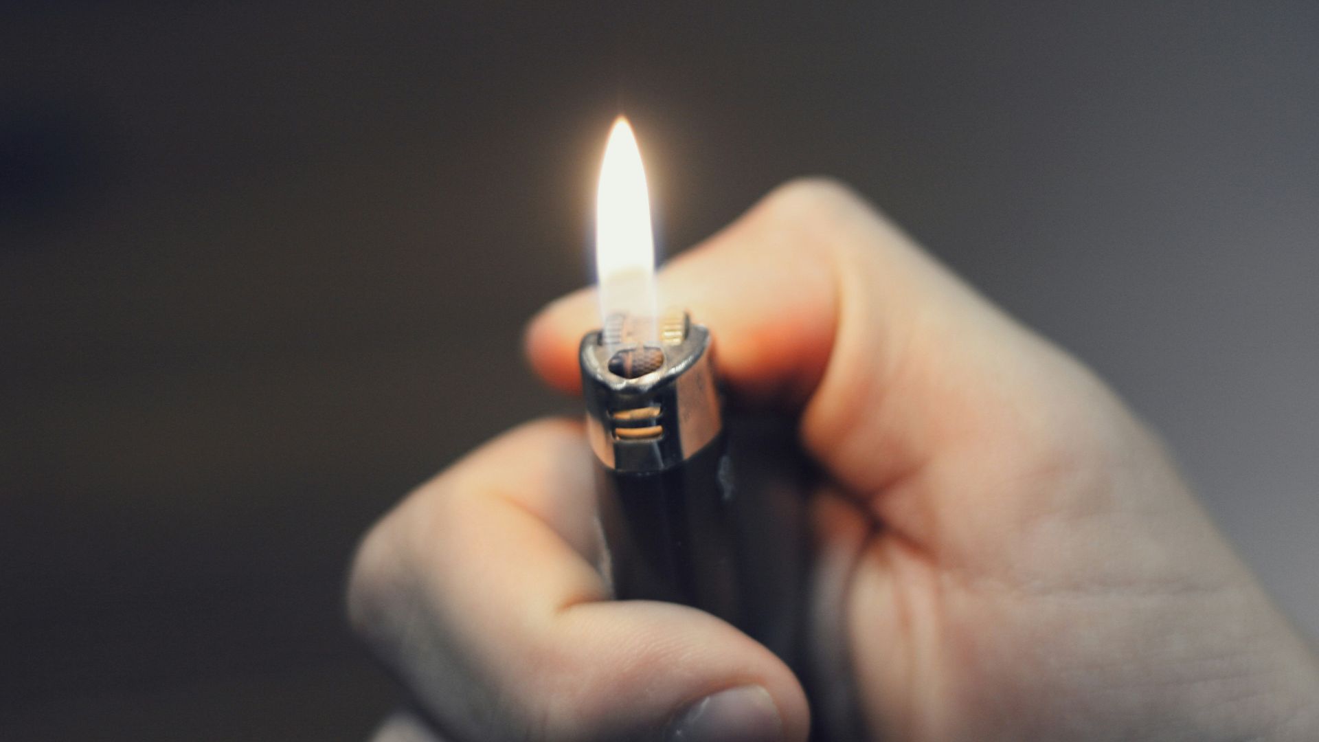 person holding black lighter