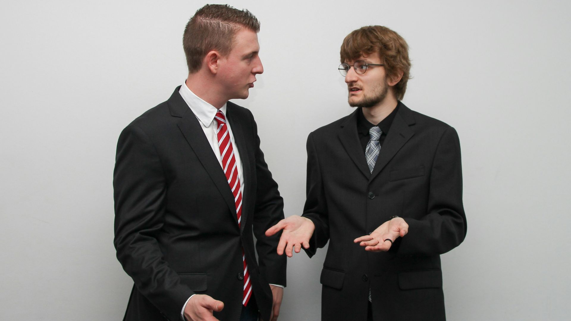 man wearing black suit jacket