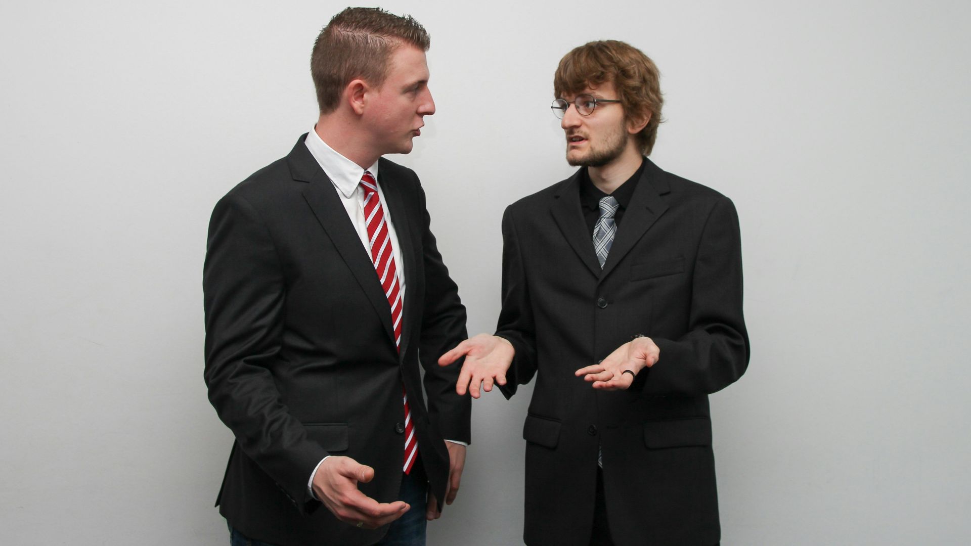 man wearing black suit jacket