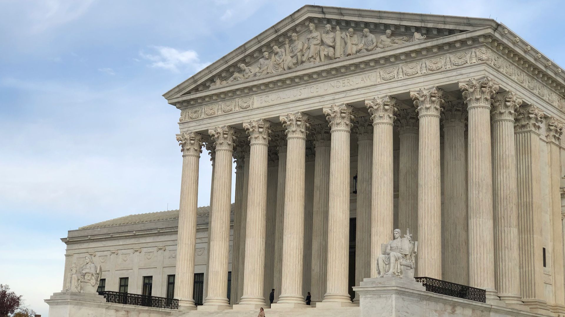 a large white building with columns and pillars