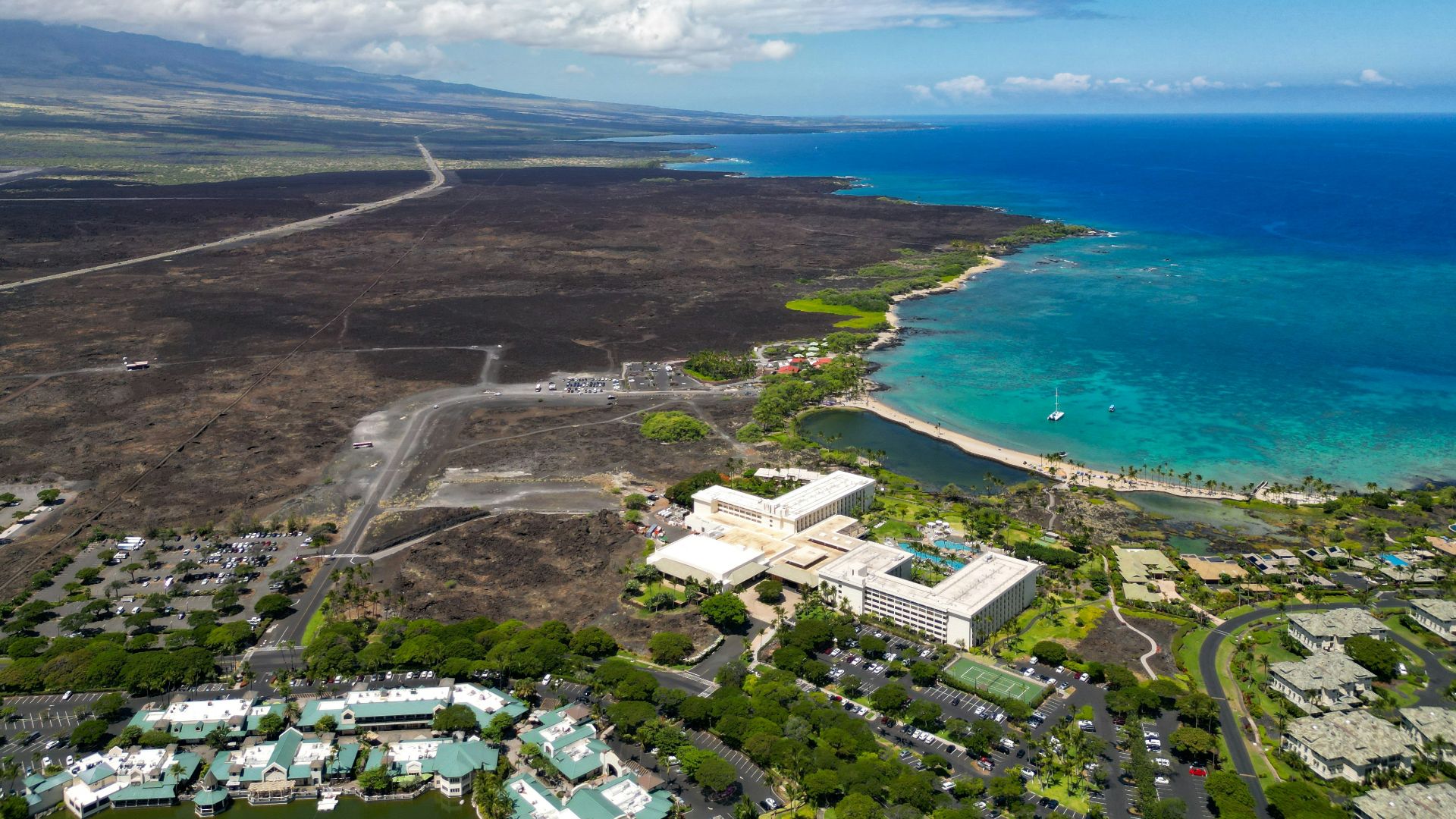 an aerial view of a city near the ocean