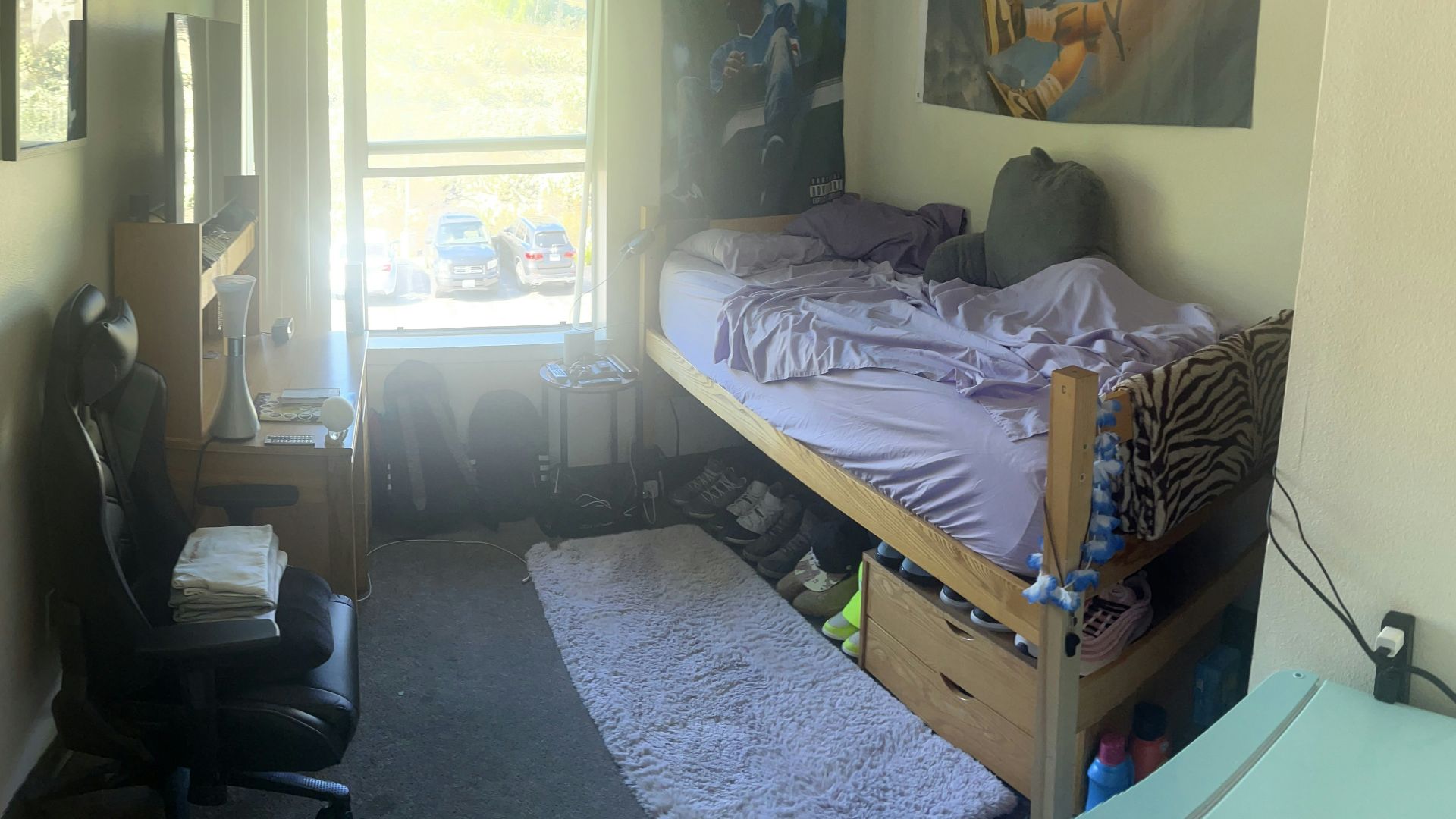 a bedroom with a bed and a desk in it