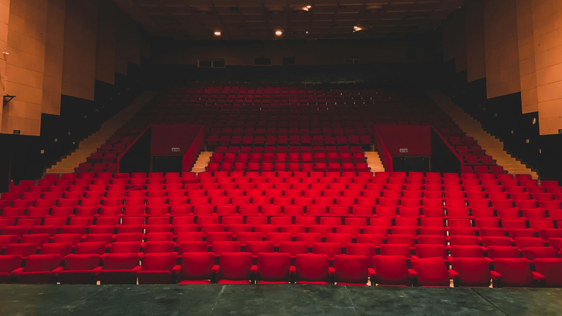 landscape photography of red seats inside a theater