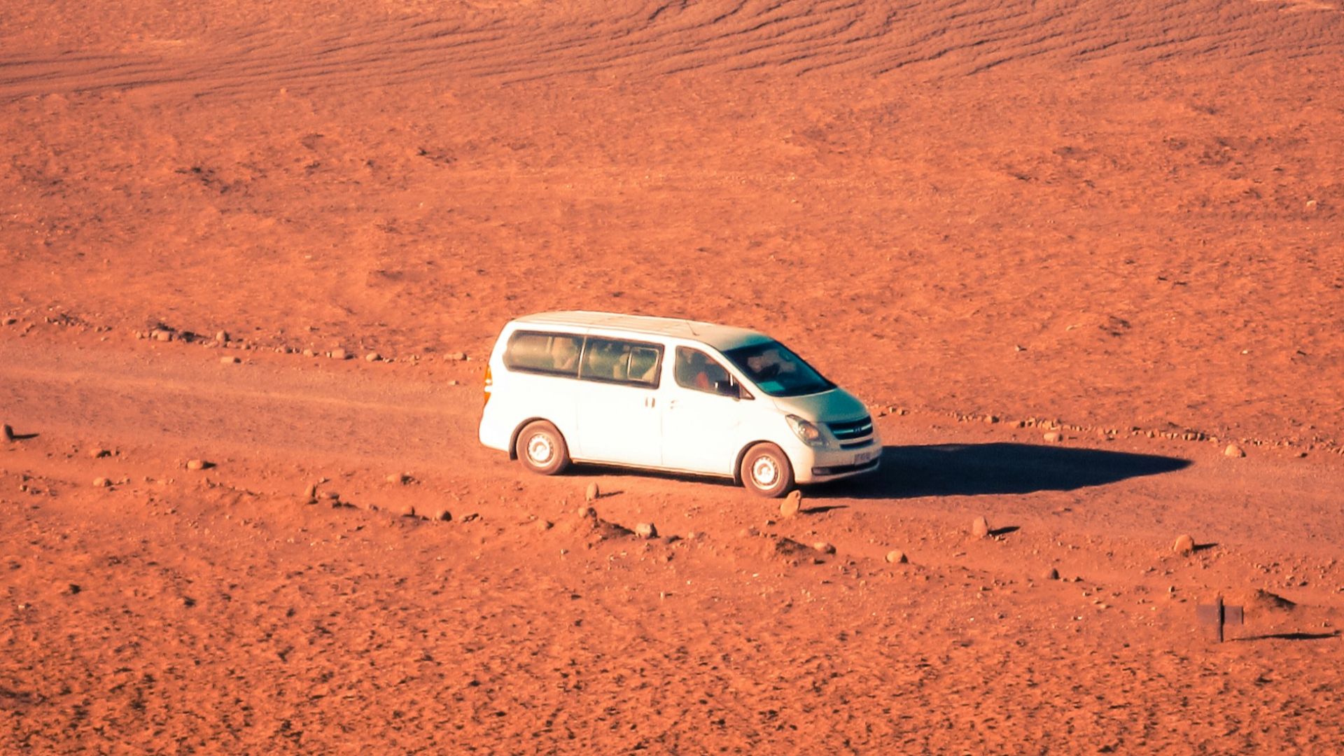white van on desert photo