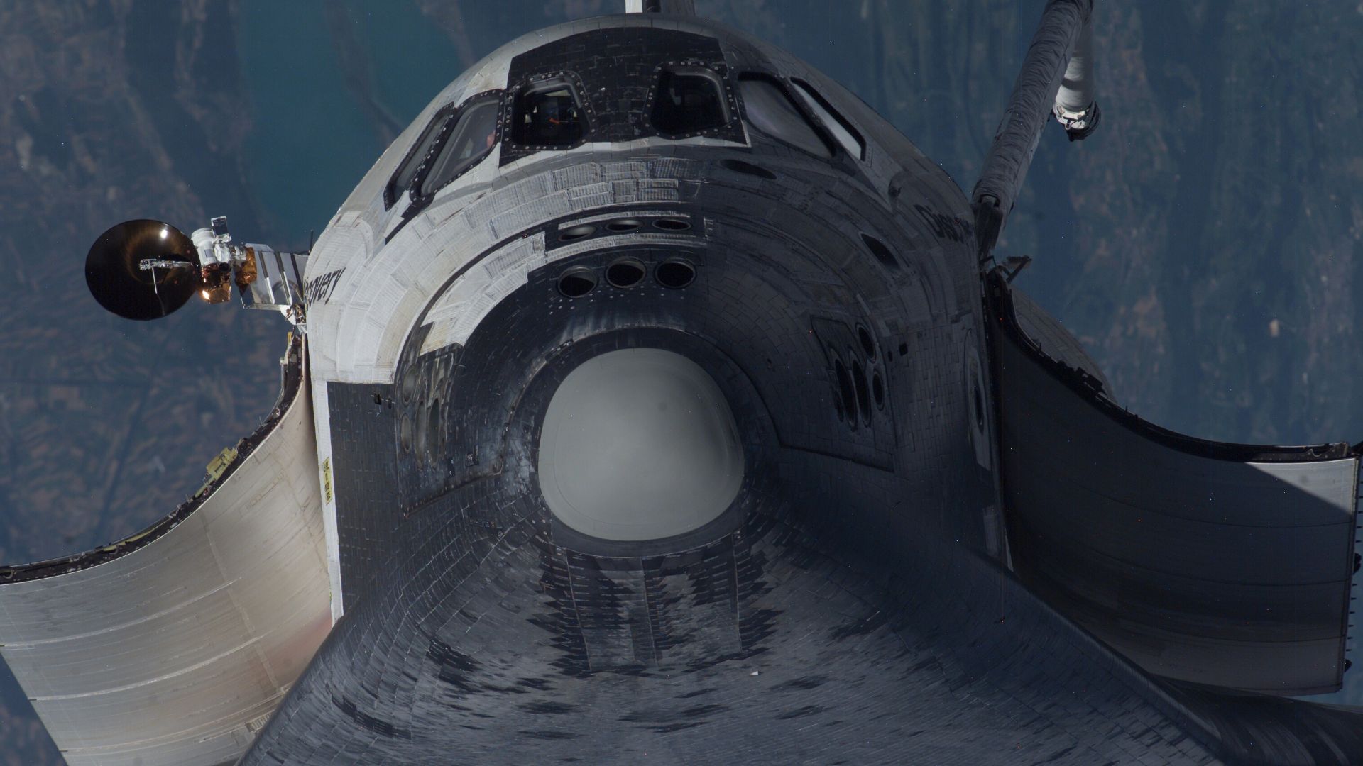 File:Thermal protection system inspections from ISS - Shuttle nose.jpg